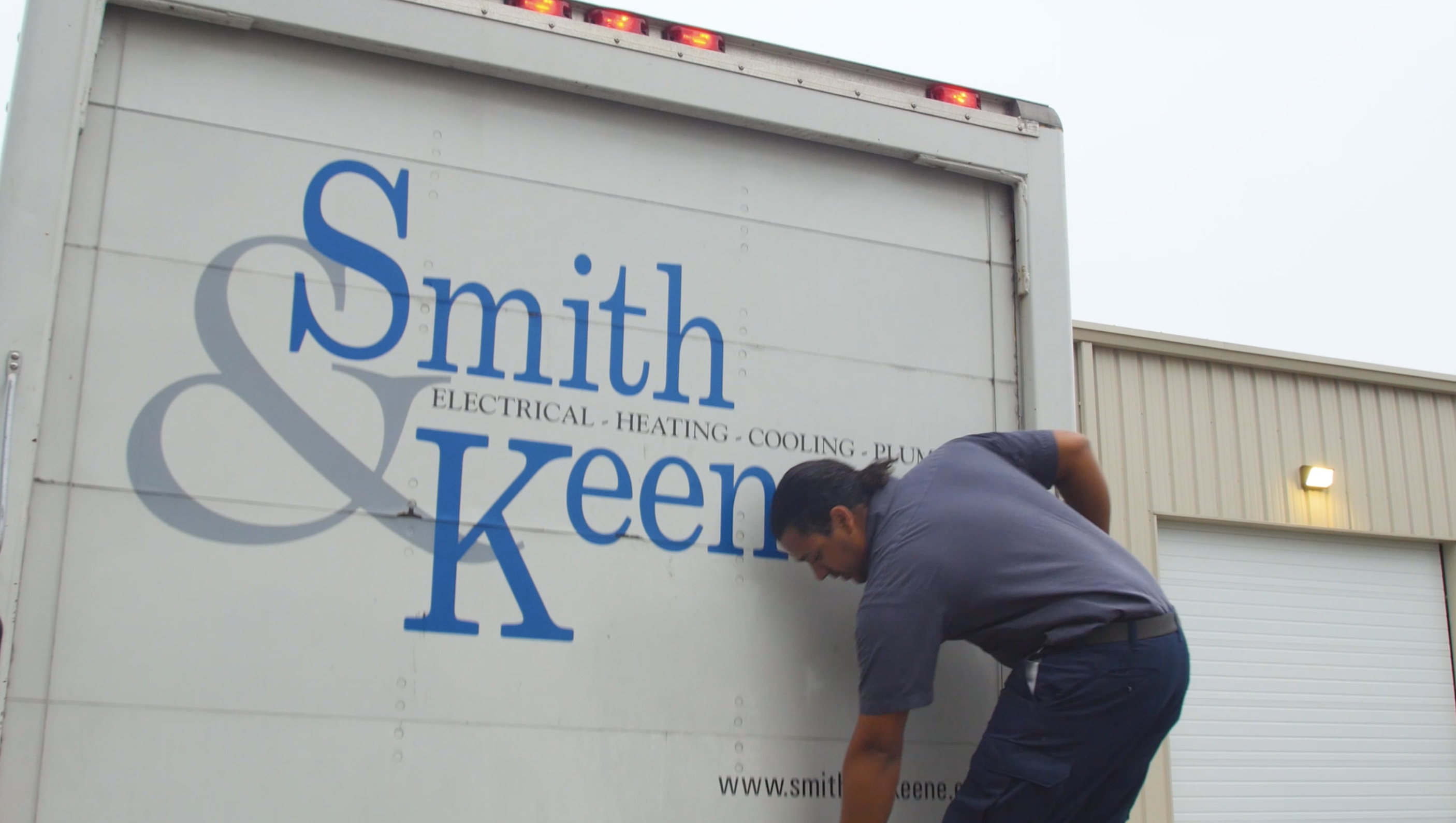 Smith & Keene truck with technician | best hvac company in hampton roads