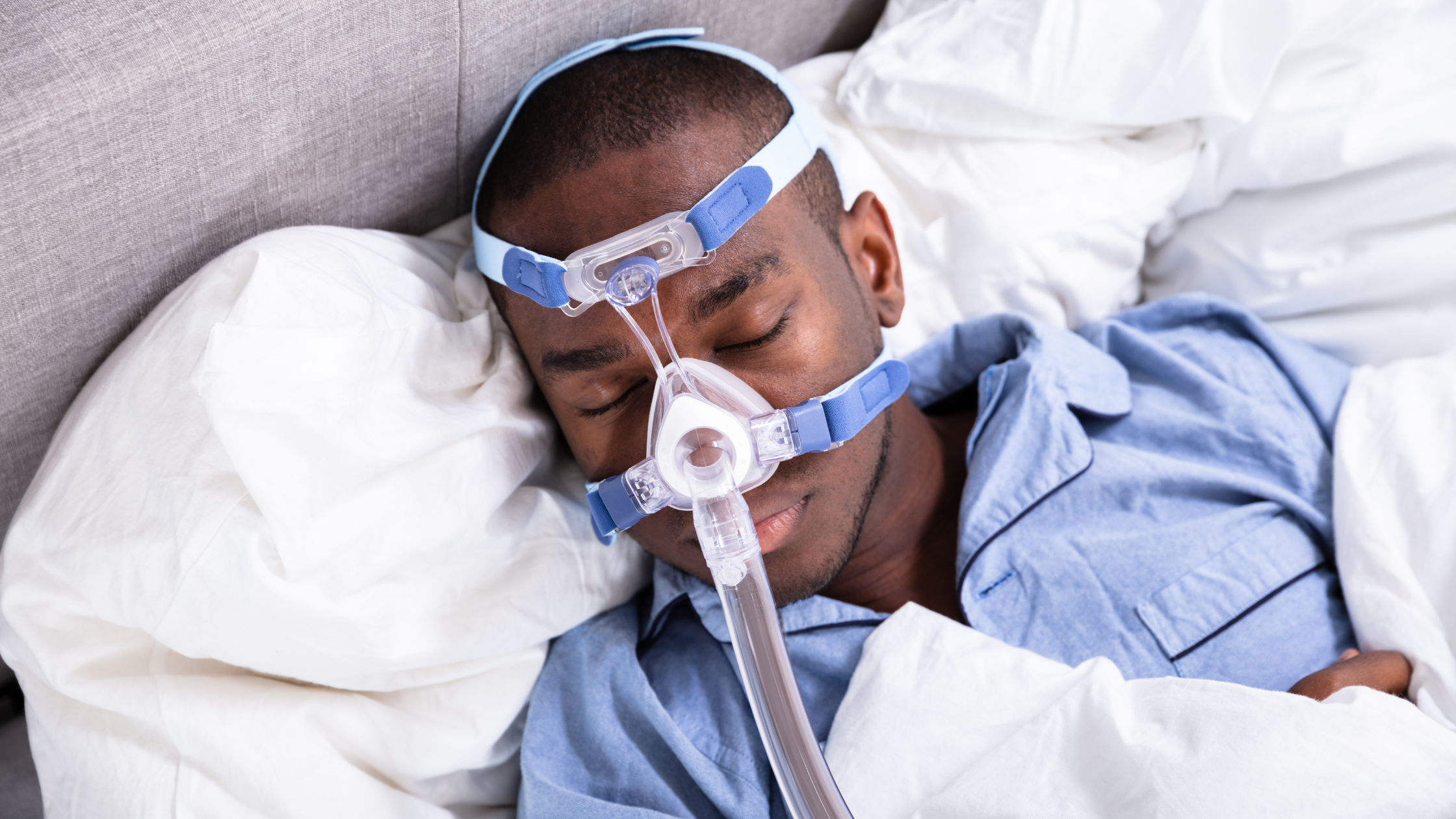 Adult male sleeping with CPAP Machine | Value of a Whole-House Generator